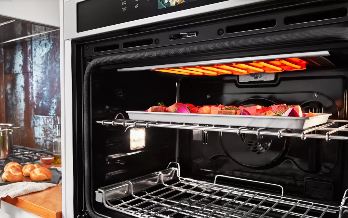 A convection oven and an air fryer arranged on a kitchen counter.