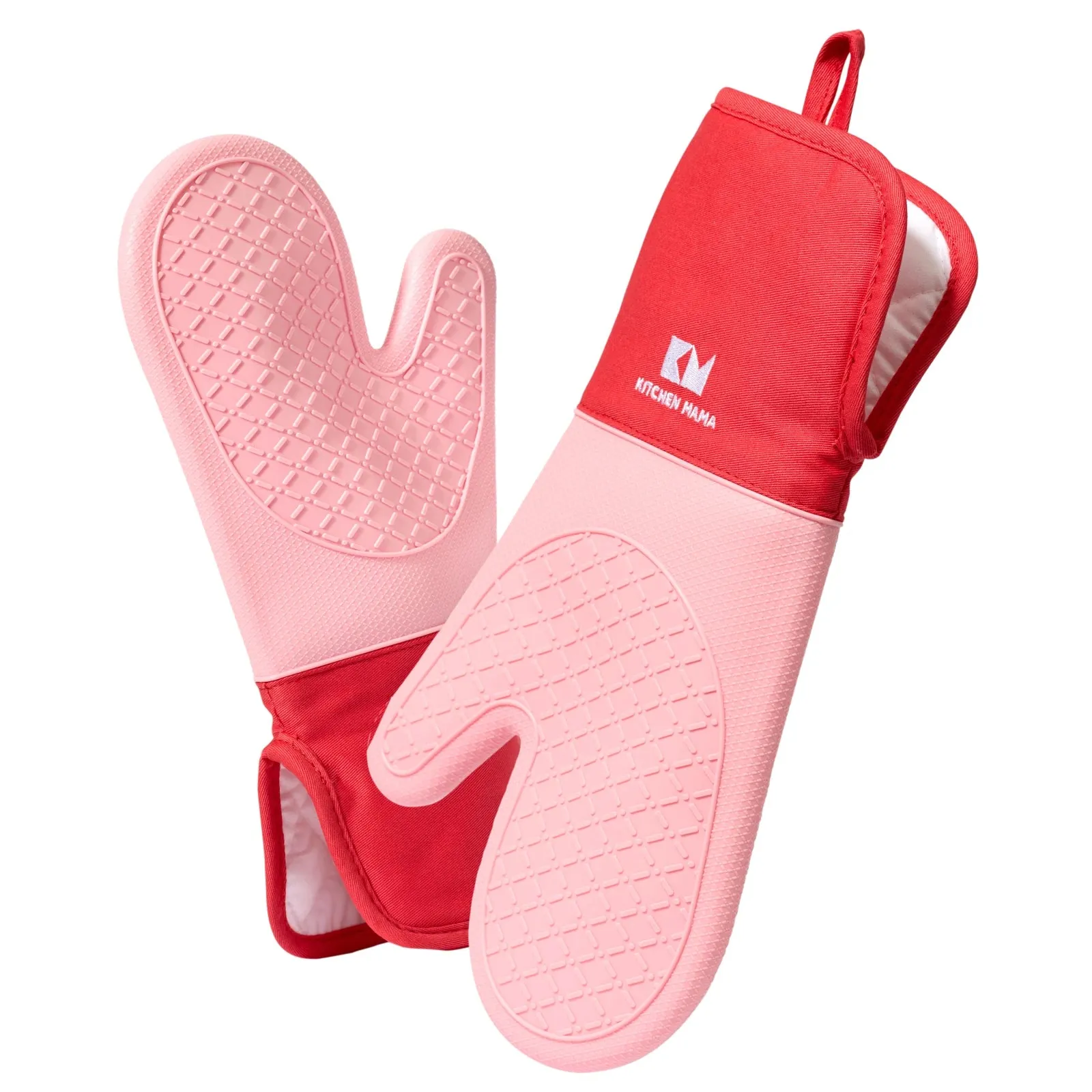 Silicone oven gloves on a wooden table with a hot pot and teapot